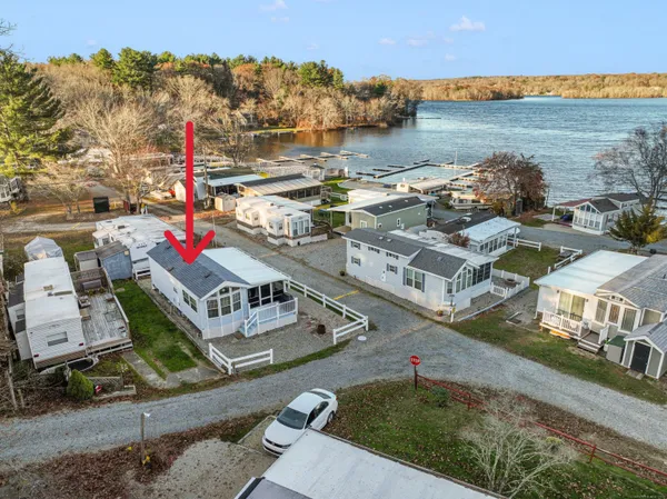 an aerial view of a house with lake view