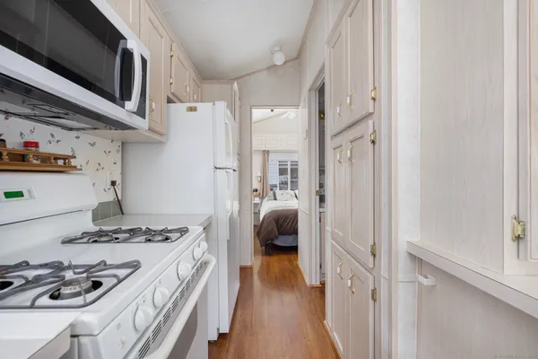 a kitchen with stainless steel appliances granite countertop a stove and a refrigerator