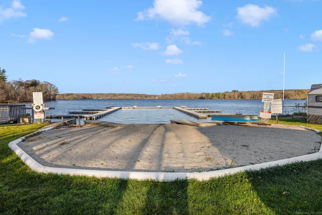 a view of a swimming pool and a yard