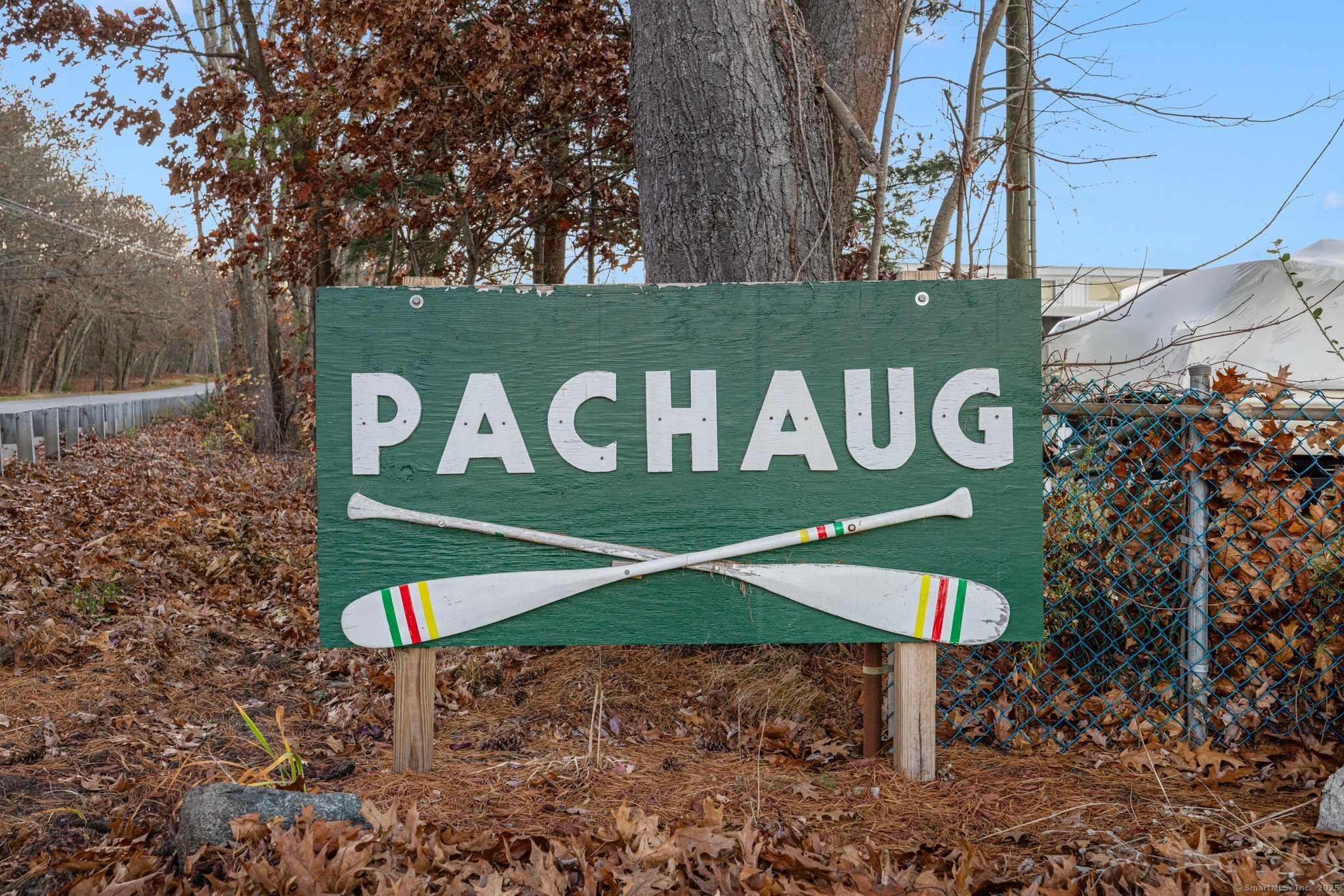 262 Shetucket Turnpike, Unit 69 Griswold, CT 06351 - Photo 37 of 37 a sign that is sitting on a wooden bench