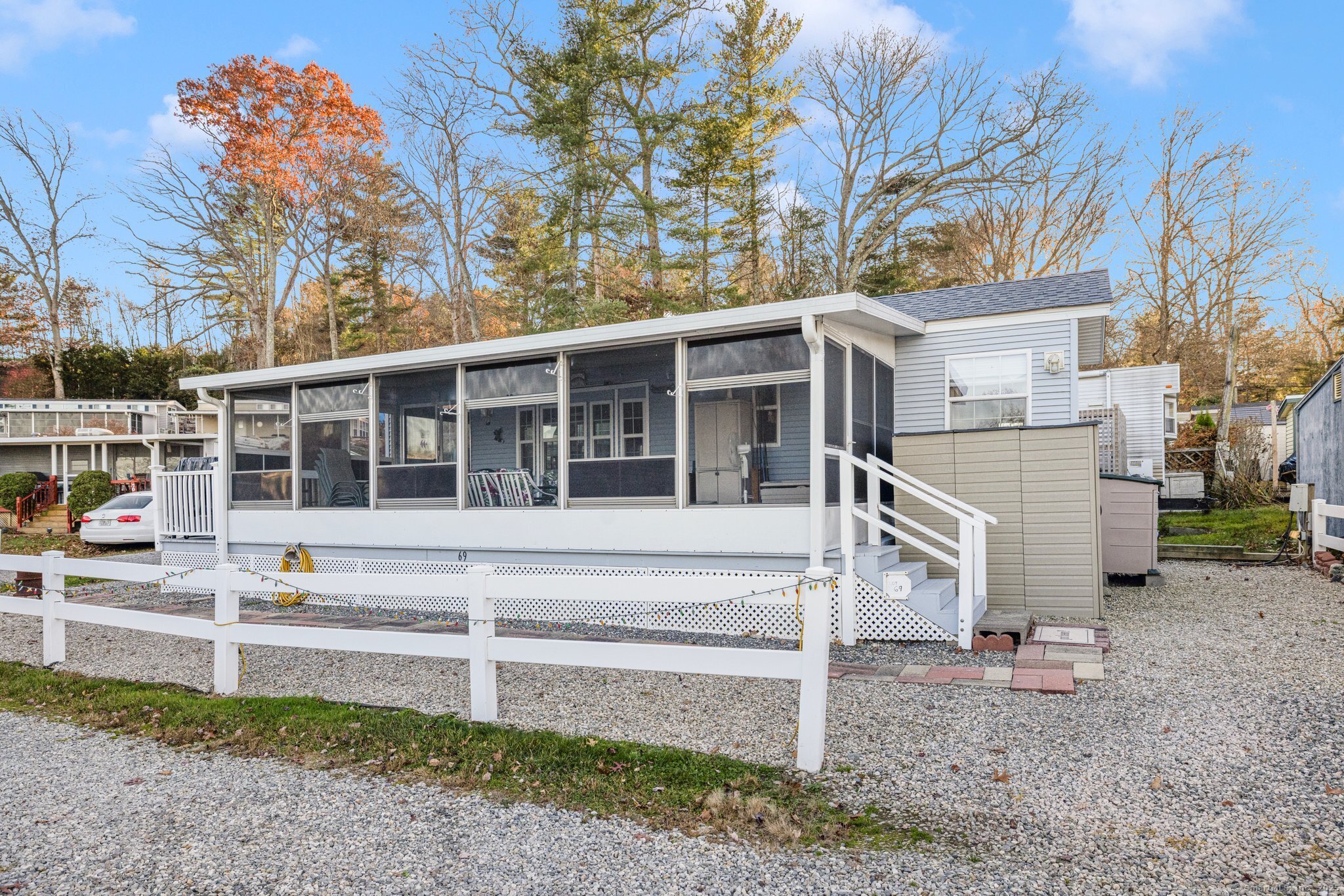 262 Shetucket Turnpike, Unit 69 Griswold, CT 06351 - Photo 5 of 37 a view of a house with a yard and large tree