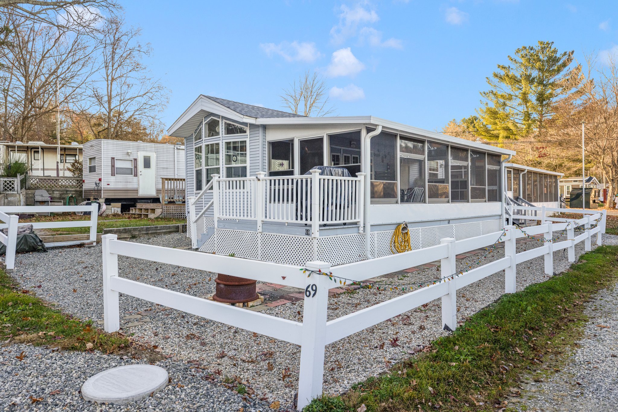 262 Shetucket Turnpike, Unit 69 Griswold, CT 06351 - Photo 6 of 37 a front view of a house with a yard