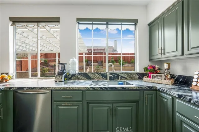 a kitchen with a sink and a window