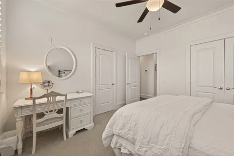 a bathroom with a granite countertop sink toilet and a mirror