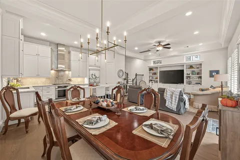 a kitchen with granite countertop white cabinets and stainless steel appliances