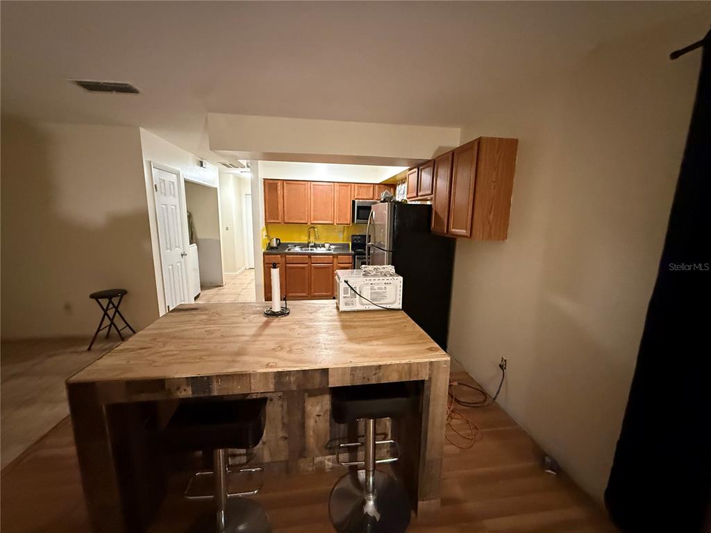 9302 Southeast Maricamp Road Ocala, FL 34472 - Photo 12 of 40 a large kitchen with a table and chairs