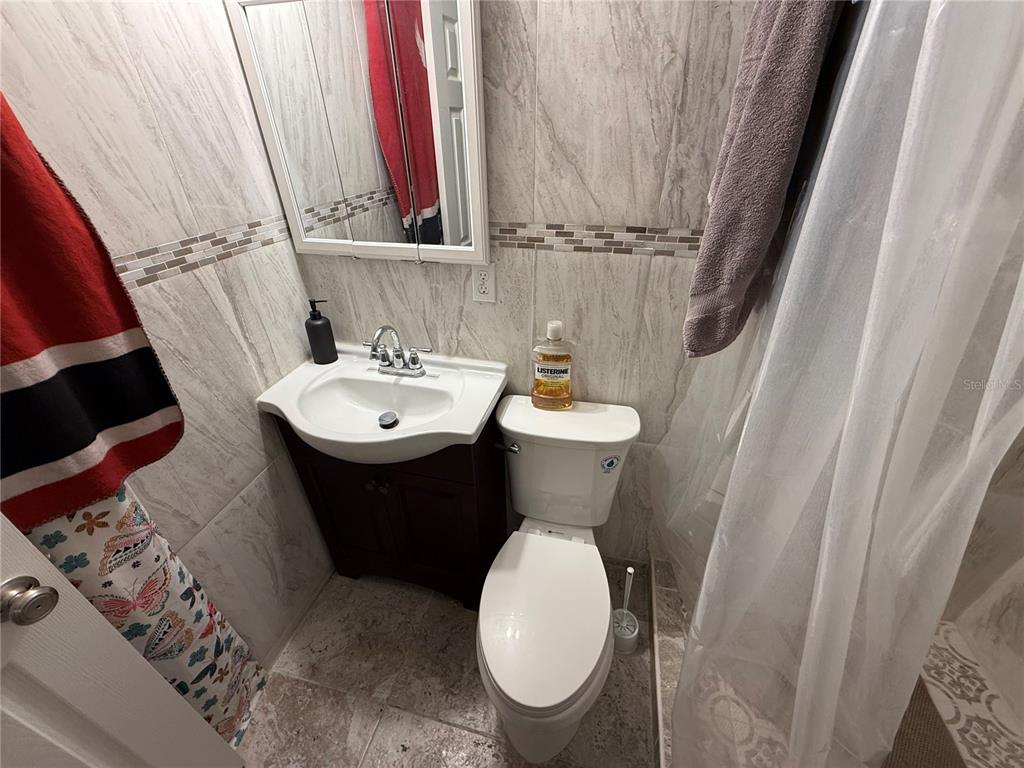 9302 Southeast Maricamp Road Ocala, FL 34472 - Photo 19 of 40 a bathroom with a sink and a mirror