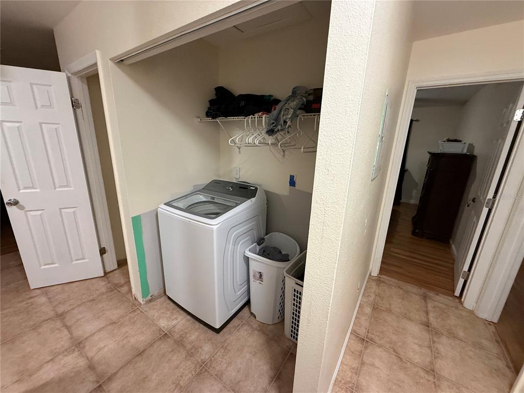 9302 Southeast Maricamp Road Ocala, FL 34472 - Photo 21 of 40 a view of a storage and utility room with a washer dryer
