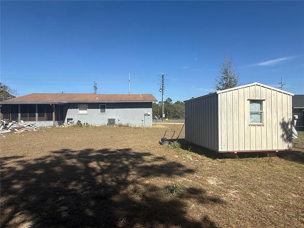 9302 Southeast Maricamp Road Ocala, FL 34472 - Photo 30 of 40 a view of a house with backyard