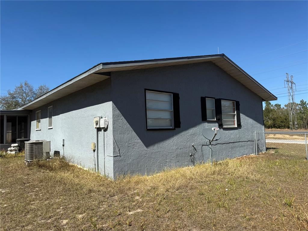 9302 Southeast Maricamp Road Ocala, FL 34472 - Photo 40 of 40 a front view of a house with a yard