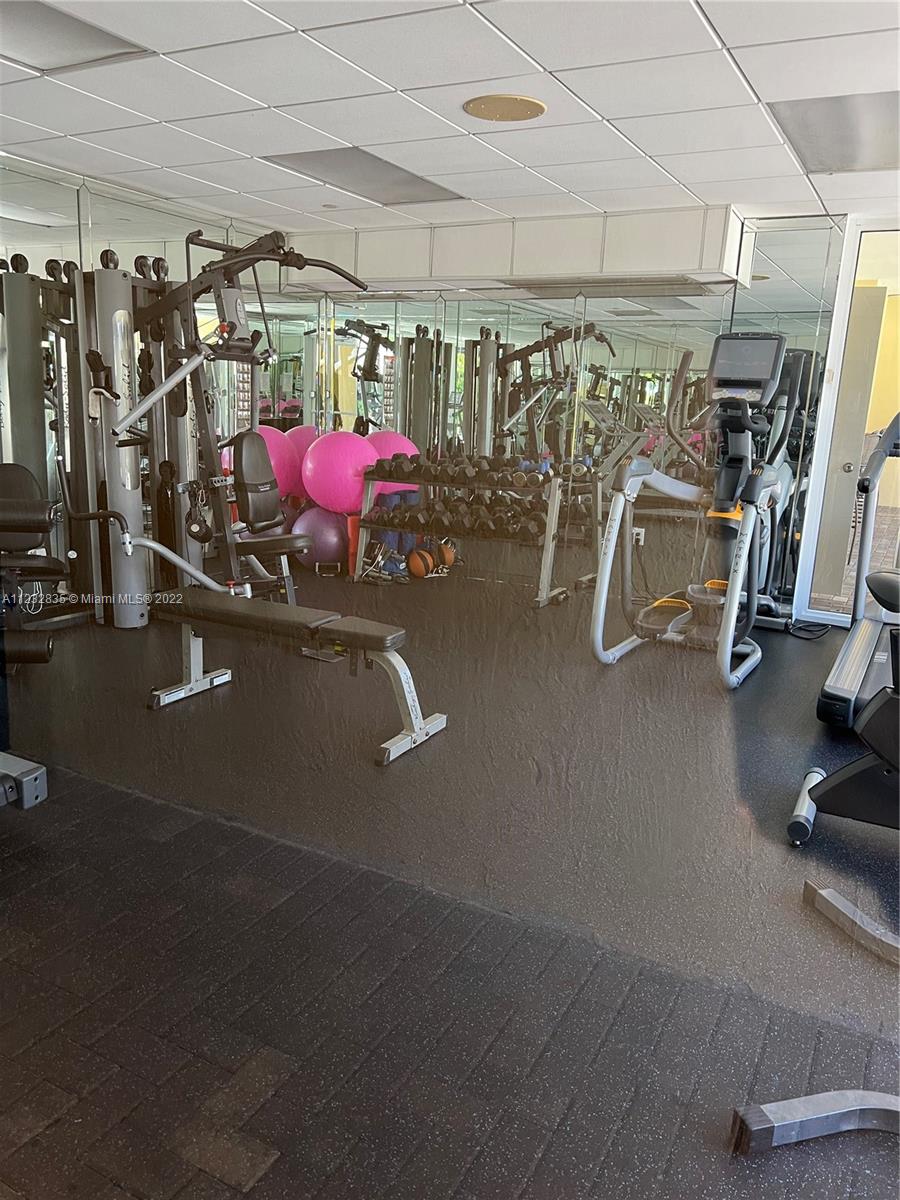 2351 Douglas Road, Unit 910 Miami, FL 33145 - Photo 12 of 24 a view of a room with gym equipment