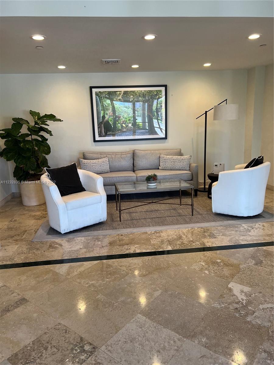2351 Douglas Road, Unit 910 Miami, FL 33145 - Photo 5 of 24 a living room with furniture and window