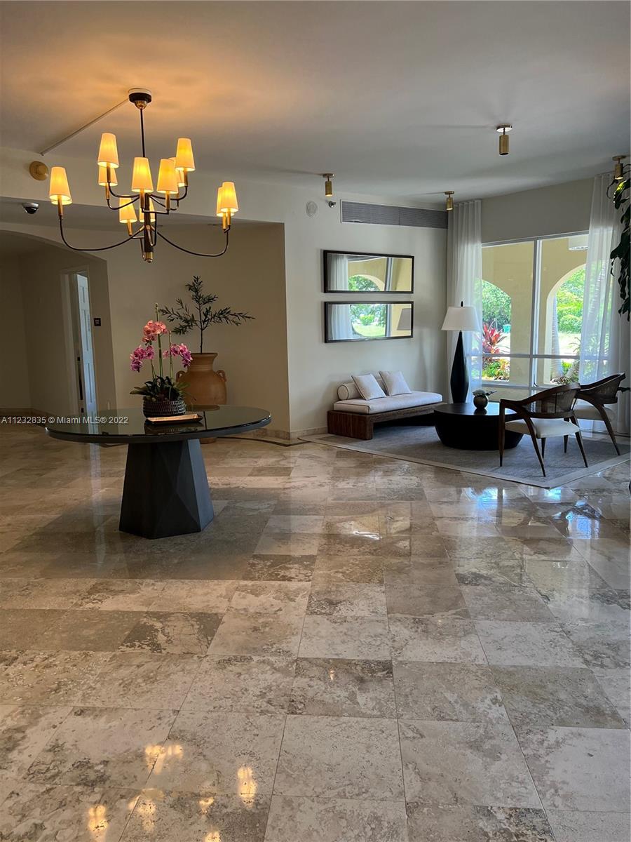 2351 Douglas Road, Unit 910 Miami, FL 33145 - Photo 6 of 24 a living room with furniture