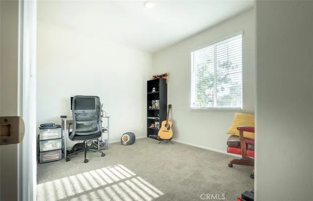 a workspace with furniture and a window