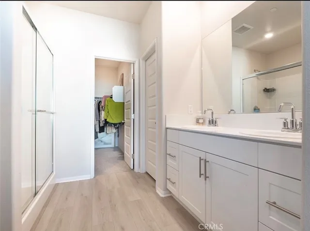 a bathroom with a sink a mirror and a toilet