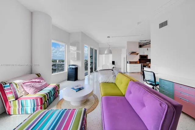 a bedroom with furniture and a book shelf