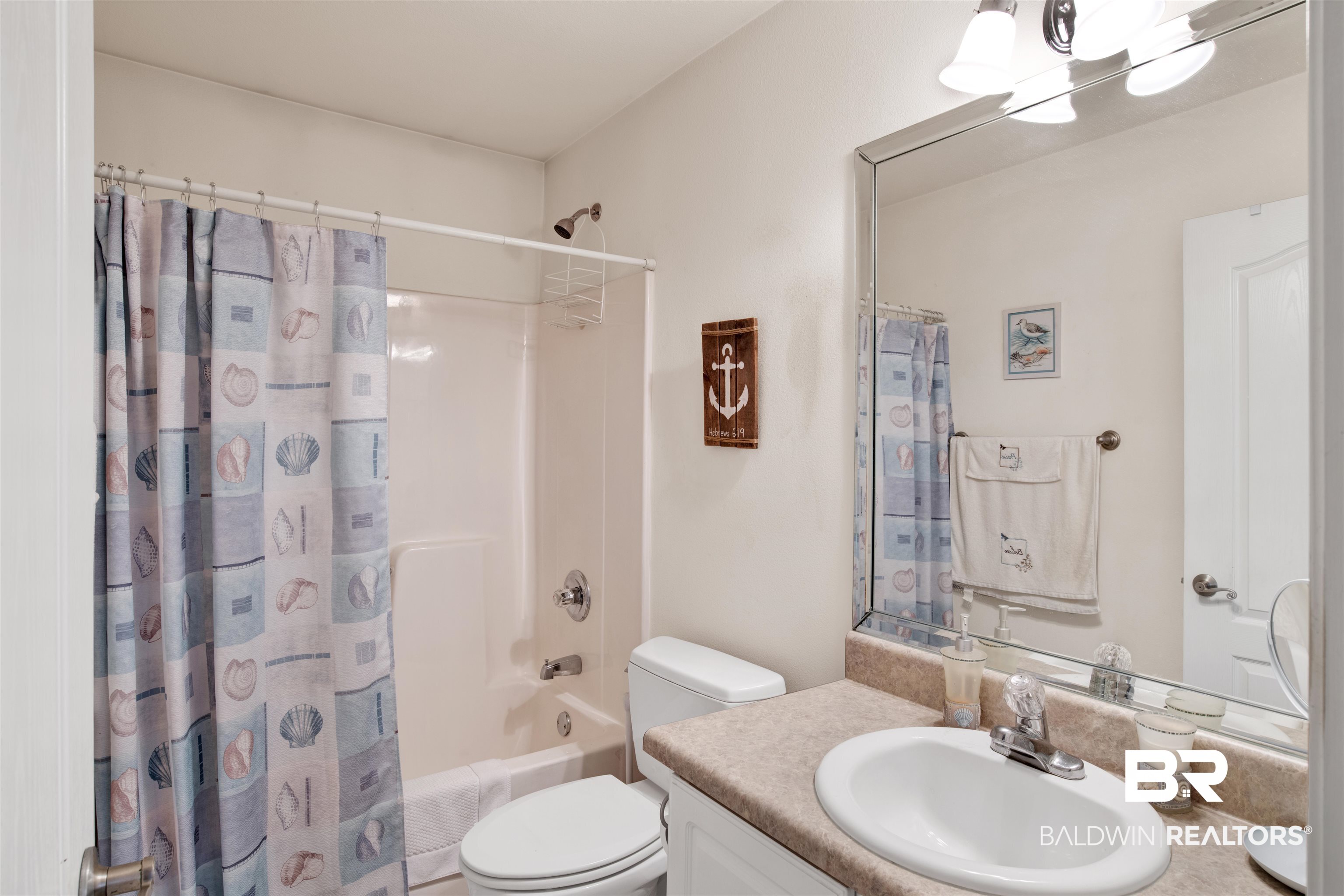 314 Blackfriars Street Fairhope, AL 36532 - Photo 15 of 25 Full bathroom with vanity, shower / tub combo with curtain, and toilet