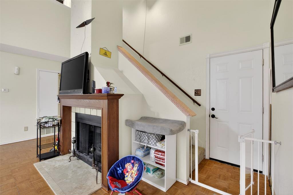 6813 Haltom Road Fort Worth, TX 76137 - Photo 8 of 14 a living room with furniture and a fireplace