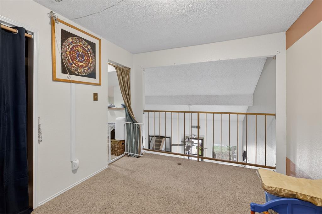 6813 Haltom Road Fort Worth, TX 76137 - Photo 9 of 14 a view of an empty room with a window