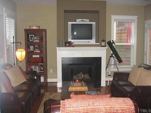 4518 All Points View Way Raleigh, NC 27614 - Photo 5 of 11 a living room with furniture and a fireplace