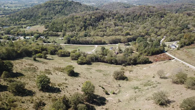 a view of a dry yard covered with snow