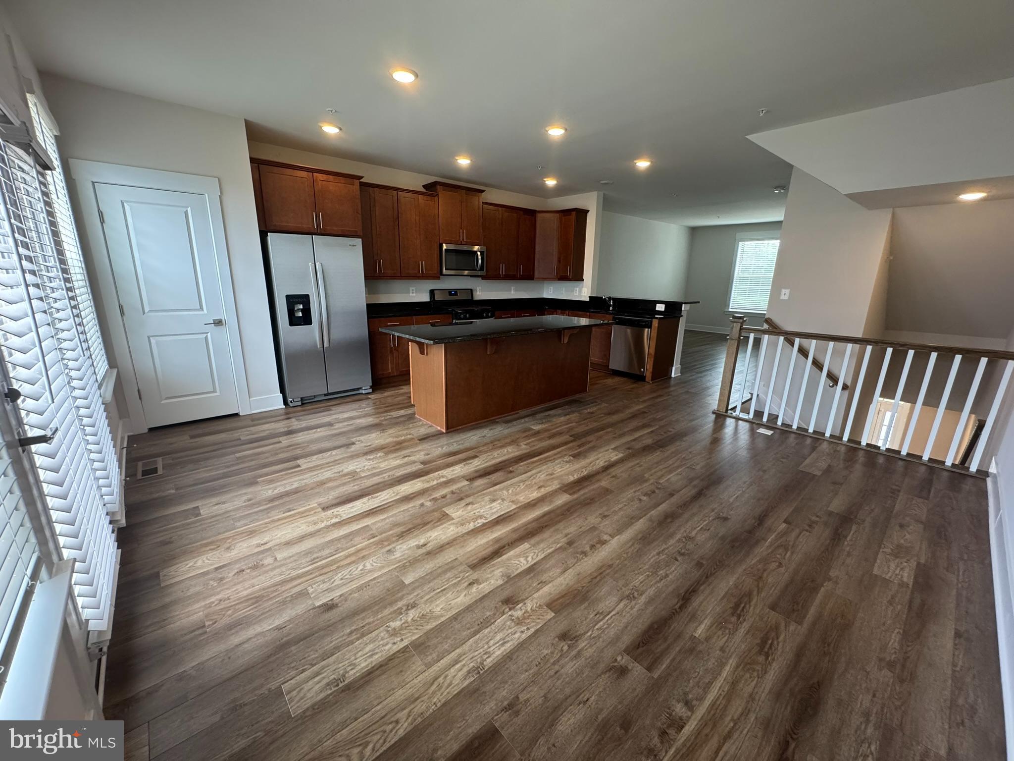 2928 Osprey Way North Frederick, MD 21701 - Photo 5 of 15 a view of kitchen with kitchen island wooden floor center island and stainless steel appliances
