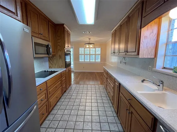 a bathroom with a sink a mirror and a bathtub