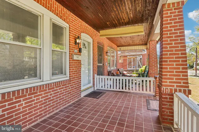 a view of a porch with wooden floor