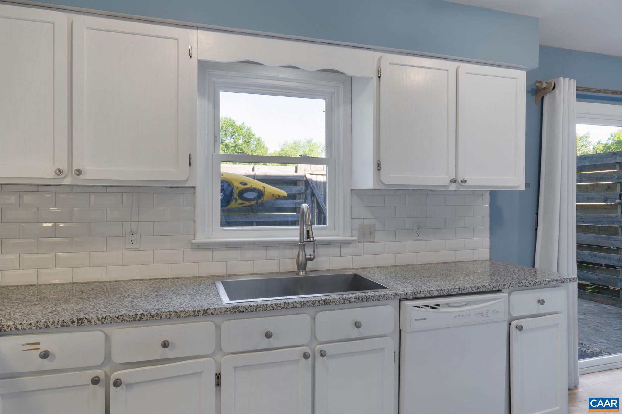 1522 Minor Ridge Court Charlottesville, VA 22901 - Photo 11 of 29 a kitchen with granite countertop white cabinets and a sink