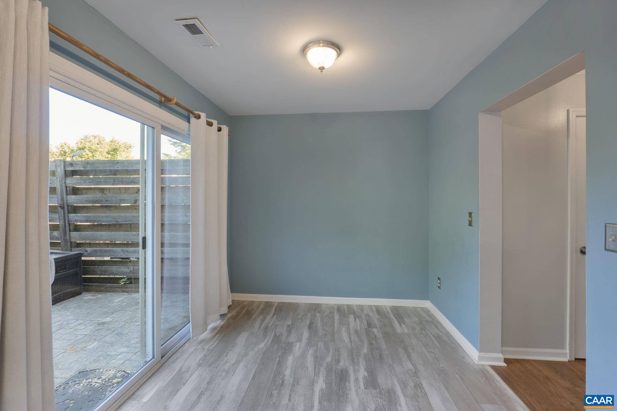 1522 Minor Ridge Court Charlottesville, VA 22901 - Photo 15 of 29 a view of empty room with wooden floor and fan