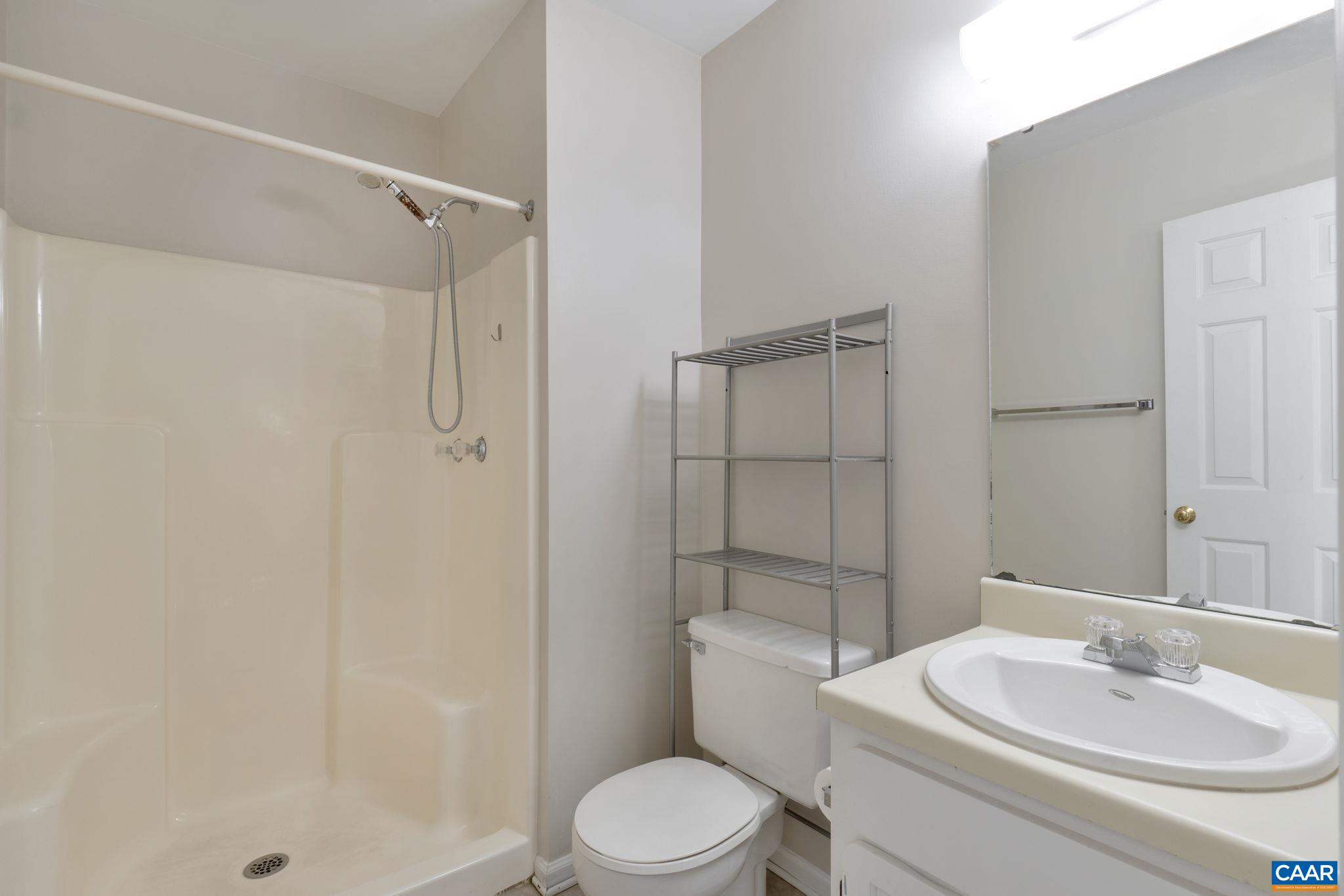 1522 Minor Ridge Court Charlottesville, VA 22901 - Photo 21 of 29 a bathroom with a sink toilet and shower