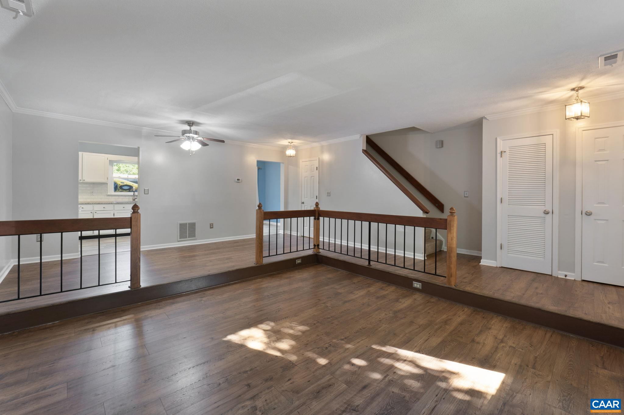 1522 Minor Ridge Court Charlottesville, VA 22901 - Photo 6 of 29 an empty room with wooden floor and windows