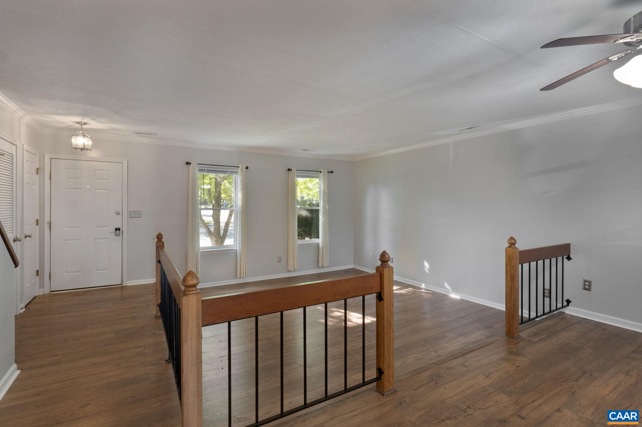 1522 Minor Ridge Court Charlottesville, VA 22901 - Photo 7 of 29 a view of a room with wooden floor and stairs