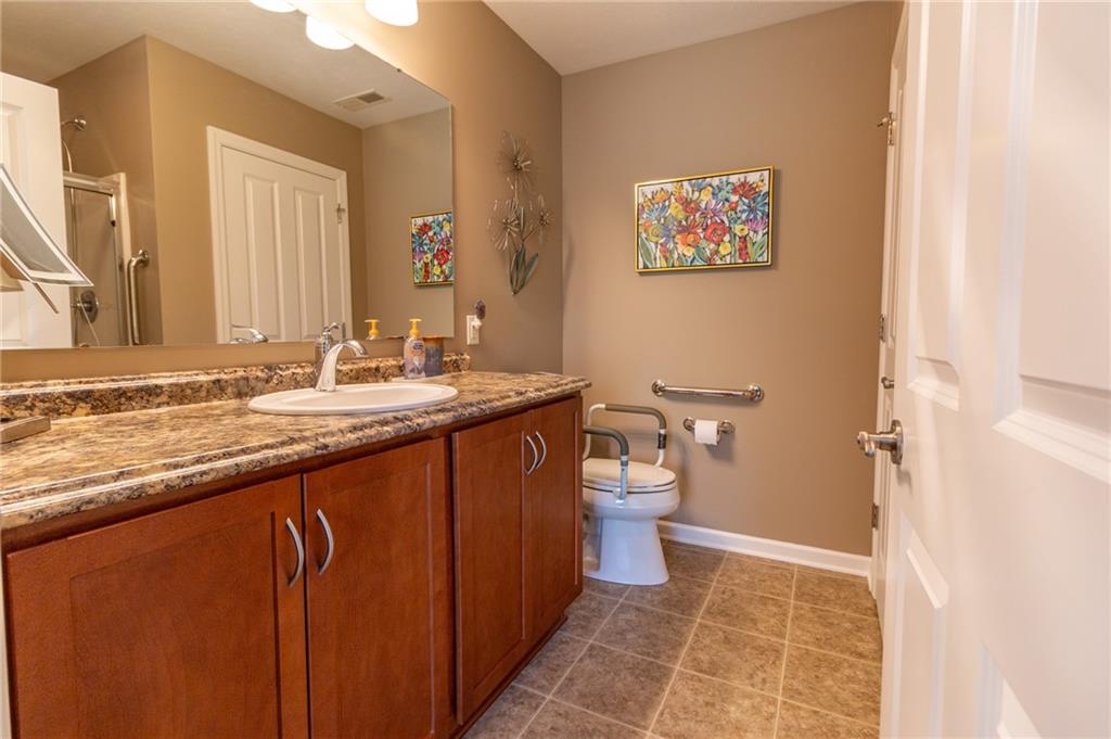 425 Chestnut Lane Apollo, PA 15613 - Photo 23 of 48 a bathroom with a granite countertop sink toilet and shower