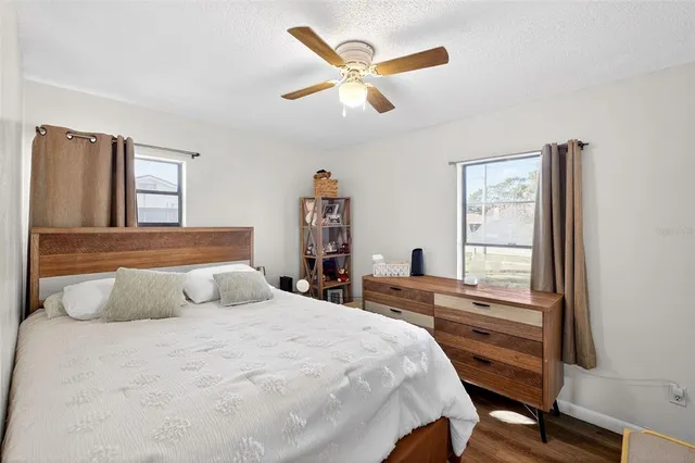 a bedroom with a large bed and a window