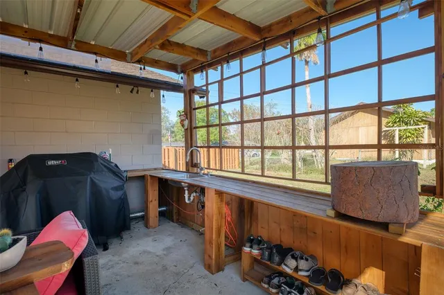 a room with lots of furniture and a window