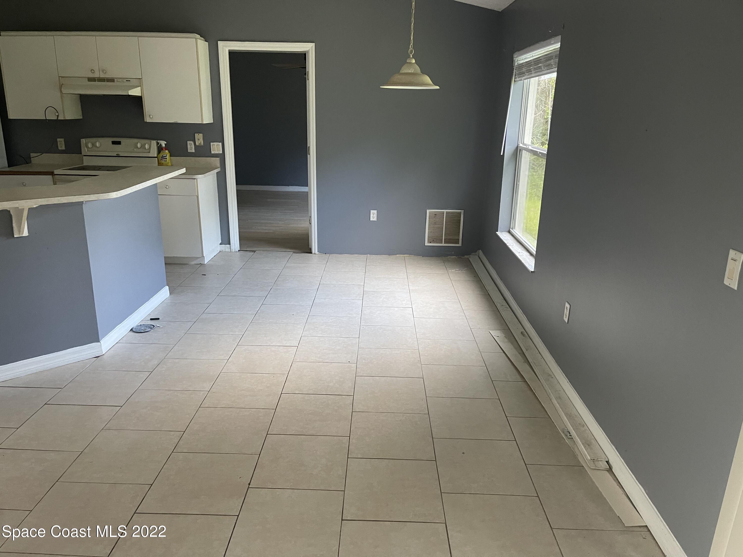 321 Sarah Road Southwest Palm Bay, FL 32908 - Photo 5 of 10 2EF89B1D-F18B-4AF7-A0E0-5D4E233DD2CD