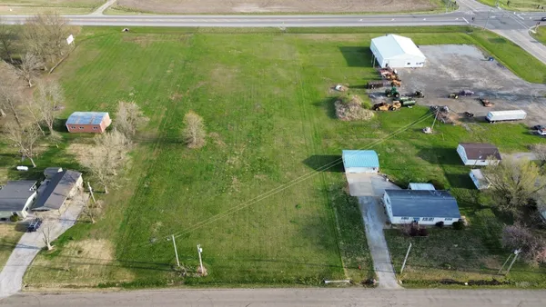 a bird view of a house with a yard