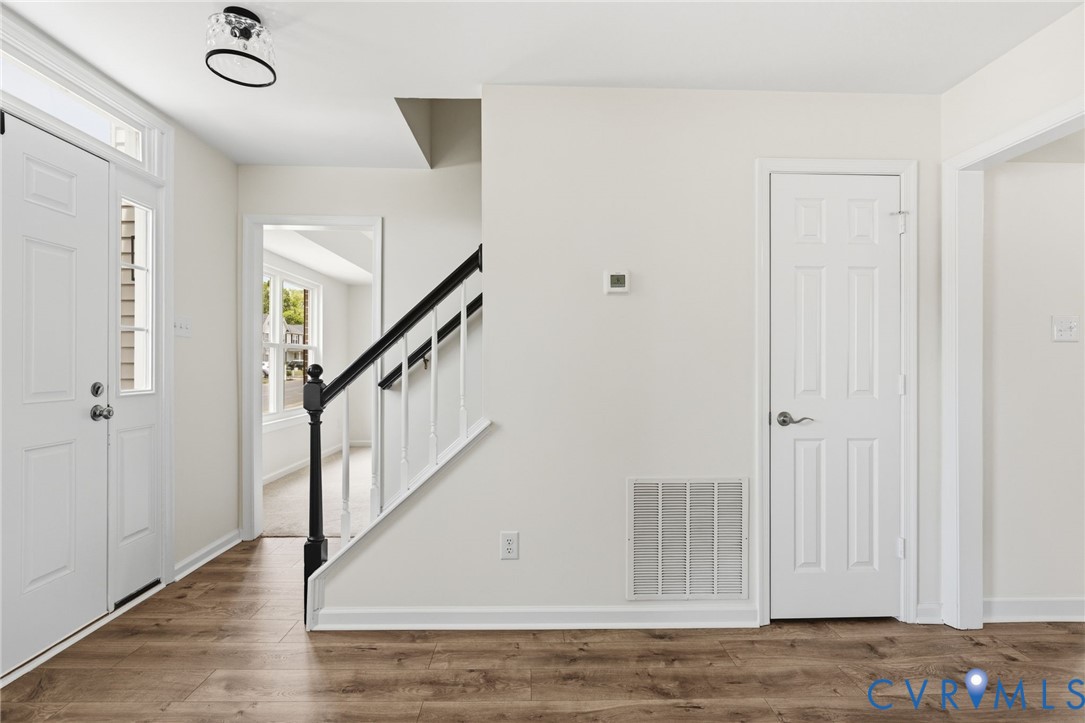 3230 Ransom Hills Road North Chesterfield, VA 23237 - Photo 13 of 27 Foyer with new flooring, new lighting and coat clo