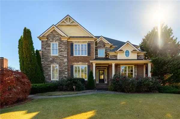 a front view of a house with garden