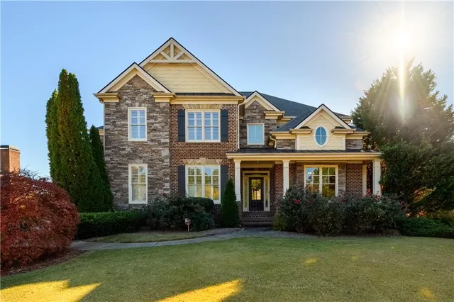 a front view of a house with garden