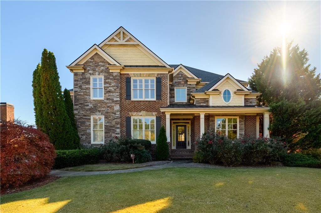 a front view of a house with garden