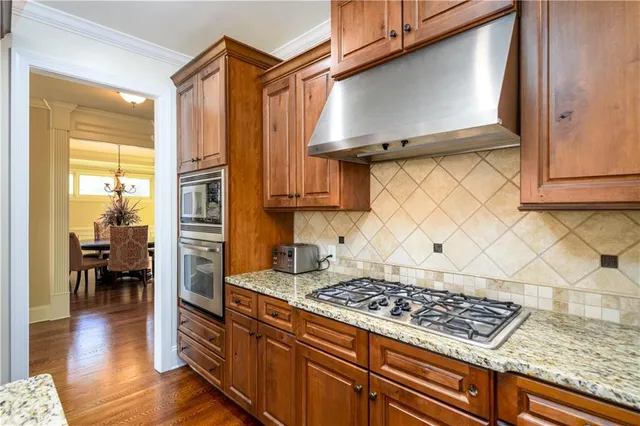 a bedroom with furniture and a flat screen tv