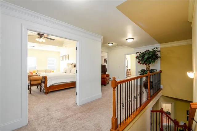 a living room with furniture ceiling fan and a window