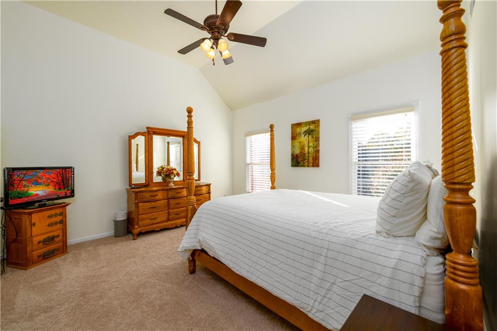 2070 Trinity Mill Drive Dacula, GA 30019 - Photo 23 of 46 a bedroom with a bed dresser and a window