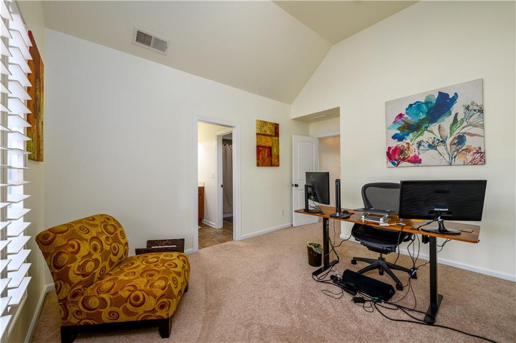 2070 Trinity Mill Drive Dacula, GA 30019 - Photo 26 of 46 a view of a livingroom with workspace and a couch