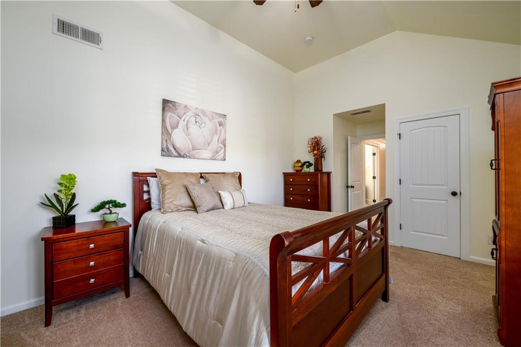 2070 Trinity Mill Drive Dacula, GA 30019 - Photo 29 of 46 a bedroom with a bed and a dresser