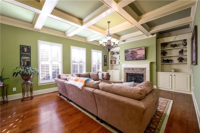 a bathroom with a granite countertop toilet sink and mirror