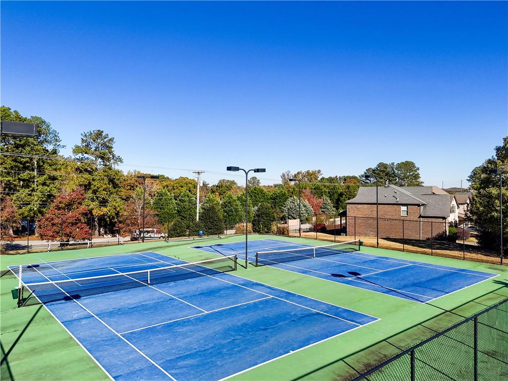 2070 Trinity Mill Drive Dacula, GA 30019 - Photo 46 of 46 a view of an outdoor space and tennis court