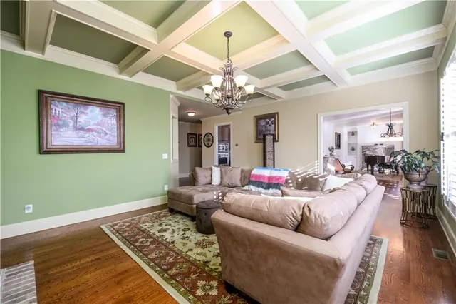 a kitchen with stainless steel appliances granite countertop a stove top oven a refrigerator a sink and dishwasher